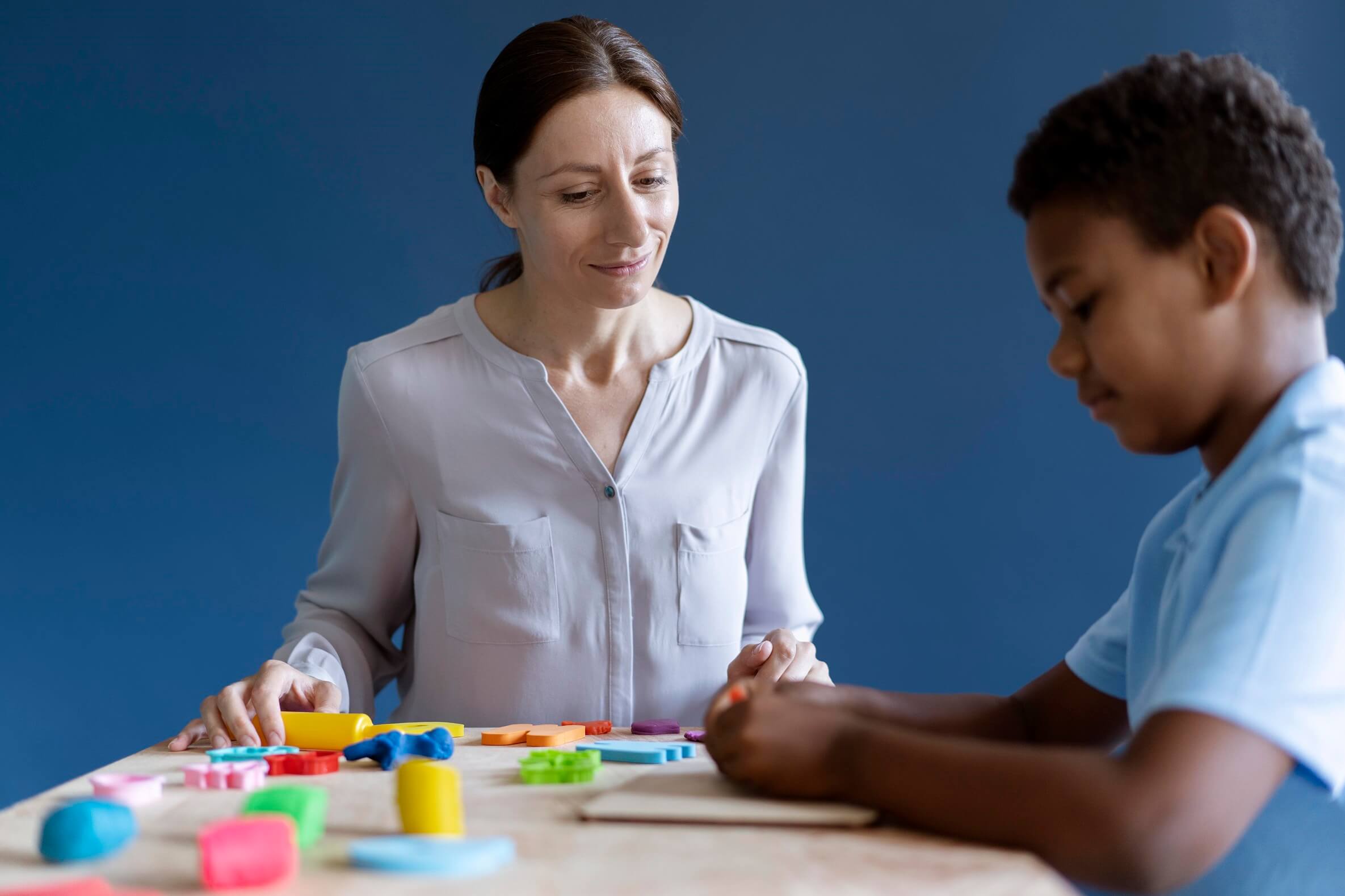 boy-doing-occupational-therapy-session-with-psychologist